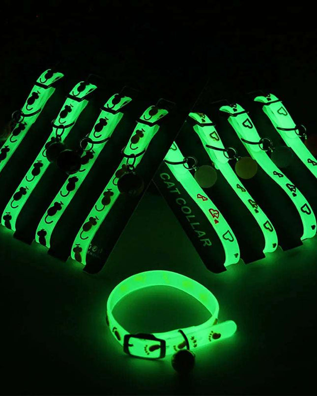 Luminous Cat Necklace glowing in the dark, featuring durable fluorescent silicone design and a small bell for safety and style.