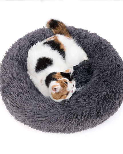 Fluffy pet bed with a kitten curled up, available in 40-100cm sizes for dogs and cats.
